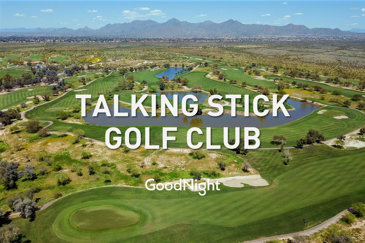 This image displays lush green golf fairways with sparkling blue water bodies and a scenic mountain backdrop. The atmosphere is relaxed and recreational, perfectly representing the upscale, renowned courses the section references.